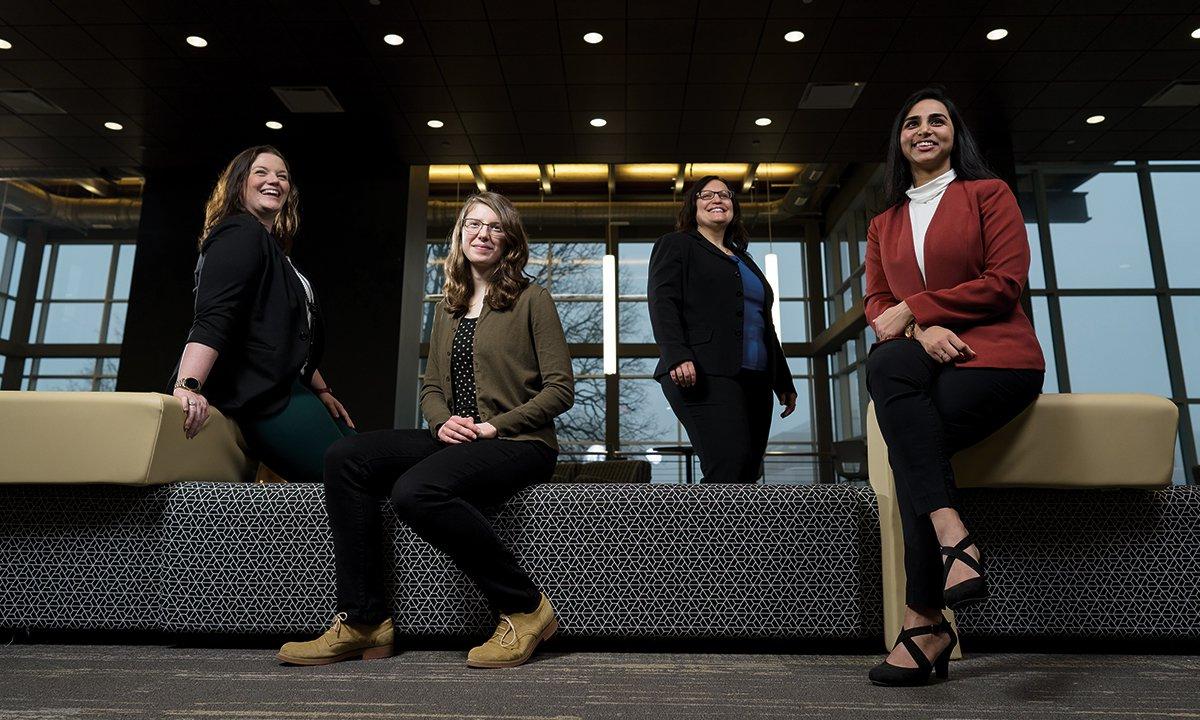 Four women posing for a photo.